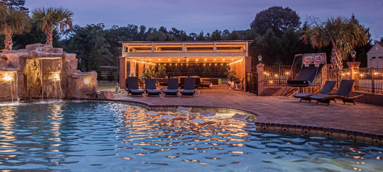 Elegant pool with rock waterfall and sunken seats